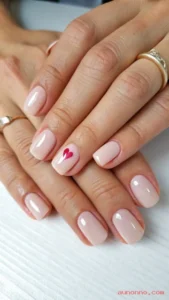 These 26 February Nails Ideas Will Make Your Winter Manicure Feel Brand New February sits right between deep winter and early spring, so your manicure can feel cozy and fresh at the same time. This list of 26 February Nails Ideas gives you wearable looks that match cold-weather outfits, Valentine vibes, and the first hint of brighter days. 1) Blush Pink Micro French Tips Blush pink keeps your nails soft and clean, and it matches almost any outfit. A thin white micro tip adds structure without looking harsh. Choose a short almond or short squoval shape for a neat, modern finish. Ask for a glossy top coat so the pink stays bright in indoor light. This look suits workdays and date nights because it feels polished but not loud. Refresh the shine every few days with a quick clear top coat. Image prompt: Full view of both hands, short almond nails, sheer blush pink base, ultra-thin white micro French tips, glossy finish, soft winter daylight, neutral background, high detail, realistic skin texture. 2) Classic Red With a Glassy Top Coat A true red manicure looks confident and timeless in February. The glossy finish makes the color look richer and more expensive. Pick a shade that leans neutral so it flatters more skin tones. Keep your cuticles clean because red highlights edges. Wear this with black coats, denim, or cozy knits and it still stands out. Use a stain-resistant base coat to prevent nail tinting. Image prompt: Full view of both hands, medium oval nails, classic neutral red polish, ultra-glossy “glass” top coat, clean cuticles, soft studio lighting, minimal background, photorealistic. 3) Burgundy Velvet Cat-Eye Nails Burgundy fits February because it feels warm and dramatic. A cat-eye shimmer creates a velvet stripe that moves with the light. Choose medium almond nails to show the magnetic effect clearly. Ask for a deep wine base with a fine shimmer, not chunky glitter. This style pairs well with gold jewelry and dark winter outfits. Apply cuticle oil daily because shimmer draws attention to dry skin. Image prompt: Full view of both hands, medium almond nails, deep burgundy magnetic cat-eye polish with velvet light stripe, glossy finish, moody winter lighting, high realism. 4) Pink-to-Red Valentine Ombre A pink-to-red ombre looks romantic without needing hearts. The blend feels soft and smooth, like a watercolor gradient. Use a sponge or airbrush effect for a seamless transition. Keep the shape short almond or medium oval so the fade looks balanced. This design works for Valentine’s week and still looks cute after. Seal the gradient with two thin top coats for depth. Image prompt: Full view of both hands, short-to-medium oval nails, smooth ombre from baby pink at cuticle to cherry red at tips, glossy top coat, clean neutral background, high detail. 5) Minimal Heart Accent Nails A nude base keeps the look calm and easy to wear. A tiny heart on one or two nails adds a February detail without clutter. Place the heart near the cuticle for a modern “peek” effect. Use a dot tool and a thin brush for crisp edges. This is great for short nails because the design stays readable. Choose red, black, or white hearts based on your outfit colors. Image prompt: Full view of both hands, short squoval nails, nude sheer base, tiny single heart accent near cuticle on ring fingers, glossy finish, soft natural light, minimal background. 6) Chocolate Brown Gloss Nails Chocolate brown feels cozy and rich in cold weather. It also looks modern and clean with a high-shine finish. Pick a warm brown if you like gold jewelry, or a cooler espresso if you prefer silver. Keep the nails medium length for a sleek silhouette. This shade hides minor chips better than bright colors. Add a quick top coat mid-week to keep the shine mirror-like. Image prompt: Full view of both hands, medium square or squoval nails, chocolate brown polish, high-gloss finish, cozy winter styling, neutral background, photorealistic. 7) Icy Blue Chrome Tips Icy blue fits February because it echoes snow and frost. Chrome tips add a futuristic twist without covering the whole nail. Use a sheer nude base so the chrome looks crisp and clean. Ask for chrome only on the tips, like a metallic French. This style looks amazing in daylight and phone flash photos. Keep the tips thin so the look stays elegant. Image prompt: Full view of both hands, medium almond nails, sheer nude base, icy blue chrome French tips, glossy finish, cool-toned lighting, clean background, high realism. 8) Soft Lavender “Early Spring” Nails Lavender brings a gentle spring mood into a winter month. The color looks calm, fresh, and flattering. Choose a creamy lavender for a smooth, opaque finish. Keep nails short-to-medium for a sweet, clean look. This shade pairs well with grey coats and pastel scarves. Use a ridge-filling base coat if your nails have texture. Image prompt: Full view of both hands, short almond nails, creamy soft lavender polish, glossy finish, bright airy lighting, minimal neutral background, photorealistic. 9) Grey Sweater Texture Nails A sweater-texture design feels perfect for February cold. The raised knit pattern adds cozy detail you can actually feel. Use a matte top coat to make the texture look realistic. Keep the color soft grey, beige, or cream for a true knit vibe. Limit the texture to one or two accent nails if you want an easier everyday look. Avoid thick layers so the design stays neat and wearable. Image prompt: Full view of both hands, medium almond nails, matte soft grey base, raised sweater knit texture on accent nails, clean lighting, neutral background, high detail. 10) White Snowflake Accent Nails White snowflakes still fit early February in many places. A nude or pale blue base keeps the snowflake crisp. Use one accent nail per hand to avoid a busy look. Add tiny dots around the snowflake for a soft “snowfall” effect. This design looks clean on short nails and elegant on almond nails. Finish with a glossy top coat so the white stays bright. Image prompt: Full view of both hands, short almond nails, sheer nude or pale icy blue base, delicate white snowflake on ring fingers, tiny snowfall dots, glossy finish, winter light. 11) Nude Nails With Gold Foil Flecks Nude nails look tidy and natural, and gold foil adds instant luxury. The foil pieces catch light in a subtle way. Place foil near the cuticle or lightly scatter it across one accent nail. Keep the nude tone close to your skin tone for a seamless look. This is a great choice for weddings, work, and daily wear. Use a smooth top coat to seal the foil edges flat. Image prompt: Full view of both hands, short squoval nails, sheer nude base matching skin tone, scattered fine gold foil flecks, glossy top coat, soft studio lighting, minimal background. 12) Black French Tips on a Sheer Base Black tips look sharp and modern, especially in February outfits. The sheer base keeps the contrast clean and wearable. Use a thin French line instead of a thick band. Choose almond or oval nails so the tips look sleek, not boxy. This design pairs well with silver jewelry and black coats. Touch up with a clear top coat to prevent tip wear. Image prompt: Full view of both hands, medium almond nails, sheer nude base, thin black French tips, glossy finish, high-contrast clean background, photorealistic. 13) Pink Aura Nails Aura nails blend color like a soft glow from the center. Pink aura feels romantic and gentle for February. Use a nude base and airbrush pink in the center of each nail. Keep the edges soft so the glow looks natural. This style flatters short nails because the gradient adds depth. Pair it with glossy top coat for a glassy “glow” effect. Image prompt: Full view of both hands, short oval nails, nude base, soft pink aura glow centered on each nail, smooth gradient edges, glossy finish, bright neutral background. 14) Milky White Almond Nails Milky white looks clean, soft, and expensive. It suits February because it feels snowy but not stark. Choose an almond shape for a gentle, elegant line. Ask for a semi-sheer “milk bath” white, not a chalky white. This style works with any outfit and any event. Apply cuticle oil daily to keep the look fresh and refined. Image prompt: Full view of both hands, medium almond nails, milky semi-sheer white polish, glossy finish, soft daylight, minimal neutral background, realistic skin detail. 15) Deep Plum With Tiny Star Glitter Plum feels rich and moody, which fits February nights. Tiny star glitter gives a playful winter-sky vibe. Use micro glitter or a few star decals so the design stays neat. Place stars on one or two nails, not all ten. This manicure looks great with cozy sweaters and evening plans. Seal decals with a thick top coat so edges do not lift. Image prompt: Full view of both hands, medium oval nails, deep plum polish, subtle tiny star glitter accents on ring and middle fingers, glossy finish, moody lighting, photorealistic. 16) “Cupid’s Arrow” Line Art Accent A nude base keeps the nails clean and simple. A thin arrow line on an accent nail adds a February story detail. Use black, red, or metallic gold for the arrow. Keep the line crisp and minimal, like a small tattoo. This is great if you want Valentine energy without hearts everywhere. Pair it with short nails for a modern look. Image prompt: Full view of both hands, short squoval nails, sheer nude base, minimal thin line art arrow on one accent nail, glossy finish, clean bright background, high detail. 17) Silver Chrome Full Set Silver chrome looks icy, bold, and very February. The mirror finish reflects light and makes nails the main accessory. Choose medium length nails so the chrome looks smooth and even. Ask for a mirror powder finish with a clear glossy seal. This style looks best with simple outfits because it already shines. Use gloves for cleaning to protect the surface. Image prompt: Full view of both hands, medium almond nails, full silver mirror chrome finish, ultra-glossy top coat, cool studio lighting, minimal background, photorealistic reflections. 18) Soft Beige With White Daisy Tips Beige feels warm and natural, like cozy winter neutrals. Small daisies bring early spring energy into the tips. Paint tiny white petals near the free edge and add a yellow dot center. Keep the daisies small so the nails stay refined. This design works well for short nails and casual outfits. Use a glossy top coat to make the flowers pop. Image prompt: Full view of both hands, short oval nails, soft beige base, tiny white daisy accents near tips with yellow centers, glossy finish, bright airy lighting, minimal background. 19) Matte Navy With Glossy Details Navy looks deep and classy in winter. A matte base with glossy swirls adds contrast without extra colors. Paint navy, apply matte top coat, then add glossy curved lines on top. Keep the swirls thin for a clean, modern effect. This style suits medium nails because it shows the texture difference clearly. Avoid oily lotions right after, so the matte stays smooth. Image prompt: Full view of both hands, medium almond nails, matte navy base, subtle glossy swirl lines, clean studio lighting, dark-to-neutral background, high detail. 20) Rose Gold Glitter Fade Rose gold feels romantic and warm, which fits February perfectly. A glitter fade gives sparkle without heavy coverage. Start with sheer nude at the cuticle and fade glitter toward the tips. Keep glitter fine so it looks smooth and elegant. This manicure works for parties and everyday wear. Seal with a leveling top coat so the fade feels glassy. Image prompt: Full view of both hands, medium oval nails, sheer nude base, rose gold fine glitter fade concentrated at tips, glossy top coat, soft warm lighting, photorealistic. 21) Tortoiseshell Accent Nails Tortoiseshell adds a rich pattern that feels stylish and grown-up. It pairs well with February neutrals like beige, brown, and black. Use tortoiseshell on two nails and a solid warm nude or brown on the rest. Ask for amber tones and soft blending for a realistic look. This design looks great on short to medium nails. Finish with a glossy top coat to bring out the depth. Image prompt: Full view of both hands, short-to-medium squoval nails, tortoiseshell pattern accents (amber, caramel, dark brown) with glossy finish, remaining nails solid warm nude, neutral background, high realism. 22) Pink Jelly Nails Jelly nails look translucent and fresh, like candy glass. They feel playful for February without being loud. Choose a rosy pink jelly that shows a hint of the natural nail. Keep the nails short or medium for a clean, sweet look. This manicure looks great with soft makeup and cozy outfits. Use a glossy top coat for a true “glass” finish. Image prompt: Full view of both hands, short oval nails, translucent pink jelly polish, high-gloss glass finish, bright clean lighting, minimal background, photorealistic. 23) Minimal Negative Space Half-Moons Negative space designs feel modern and tidy. A half-moon near the cuticle adds shape and clean contrast. Use nude as the base and paint a thin half-moon in red, black, or white. Keep lines sharp and symmetrical across both hands. This is a smart choice for short nails because it elongates the nail bed. Seal carefully so the edges stay crisp. Image prompt: Full view of both hands, short squoval nails, nude base, clean half-moon design near cuticle in deep red, glossy finish, bright neutral background, high detail. 24) Emerald Green With Subtle Shimmer Emerald green adds a jewel-tone pop in winter. A subtle shimmer makes it look richer without looking glittery. Choose medium almond nails to show the color depth. Ask for a fine shimmer that looks smooth in daylight. This shade pairs well with gold rings and neutral coats. Use two thin coats for even coverage and less chipping. Image prompt: Full view of both hands, medium almond nails, emerald green polish with subtle fine shimmer, glossy finish, soft studio lighting, minimal background, photorealistic. 25) “February Sky” Cloud Nails Cloud nails feel dreamy and calm in a winter month. A soft blue base with white clouds creates a gentle sky effect. Keep clouds fluffy and spaced out so the design stays clean. Add tiny white dots for a light “snowy sky” feel. This design looks cute on short nails and playful on medium nails. Finish with glossy top coat for a soft, airy shine. Image prompt: Full view of both hands, short almond nails, soft sky-blue base, fluffy white cloud art with tiny white dots, glossy finish, bright clean background, high detail. 26) Pisces Season Nails With Tiny Constellations Late February brings Pisces season, and star details fit the mood. Tiny constellations look elegant and personal. Use a deep navy or soft nude base depending on your style. Add small dot-and-line constellations on one or two nails. This manicure feels special without being busy. Seal with a smooth top coat so the lines stay crisp. Image prompt: Full view of both hands, medium oval nails, deep navy base, delicate tiny constellation dot-and-line art in silver on accent nails, glossy finish, moody night-sky lighting, photorealistic. FAQs About 26 February Nails Ideas What nail colors work best for February? Red, burgundy, chocolate brown, navy, and milky white fit the season well. Soft pink and lavender also work because they hint at spring. What nail shape looks most flattering for everyday wear? Short almond and short squoval look balanced on most hands. These shapes also reduce snags and tip breaks. How do I make my manicure last longer in winter? Use a base coat, cap the tips, and apply top coat every few days. Wear gloves for cleaning and cold outdoor errands. Are February nail designs okay for short nails? Yes, short nails look great with micro French tips, minimal hearts, and negative space designs. Simple art looks sharper on shorter lengths. What is the easiest February nail idea to DIY at home? A solid color like classic red or chocolate brown is very beginner-friendly. A tiny heart accent on one nail is also easy with a dot tool. How can I keep cuticles from looking dry in February? Apply cuticle oil once or twice a day. Use hand cream after washing to lock in moisture. Can I wear Valentine nails after February 14? Yes, choose subtle details like pink aura, blush micro tips, or a red ombre. These styles feel romantic without looking date-specific. What top coat finish looks best for February styles? Glossy top coat works best for chrome, jelly, and ombre looks. Matte top coat works best for sweater textures and modern navy designs. How do I choose a nude base that matches my skin? Pick a nude that looks close to your natural tone but slightly softer. Test by holding the bottle near your fingertip in daylight. Conclusion: 26 February Nails Ideas That Keep Your Manicure Fresh All Month